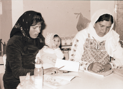Two Female Students Attending a Class on Literacy  
