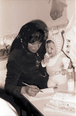 A Mother Accompanied by her Child During One of the Literacy Classes 