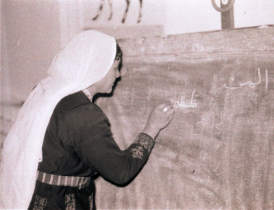 A Student During One of the Literacy Classes While Writing on the Board