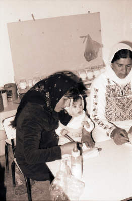 Two Female Students Receiving Treatment During One of the Literacy Classes  