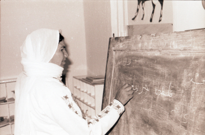 A Female Student Writing on the Board During Literacy Classes 
