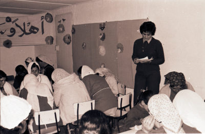 Literacy Program Teacher Accompanied by her Female Students  