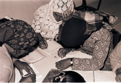 Women and Young Women Receiving Education During One of the Literacy Classes 