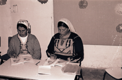 Two Students Reading the Lesson During One of the Literacy Classes 