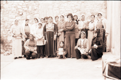 A Group Photograph of Female Students During One of the Literacy Classes Accompanied by their Teacher 