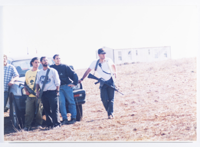 A group of Israeli settlers standing on a confiscated land near Turmus Ayya