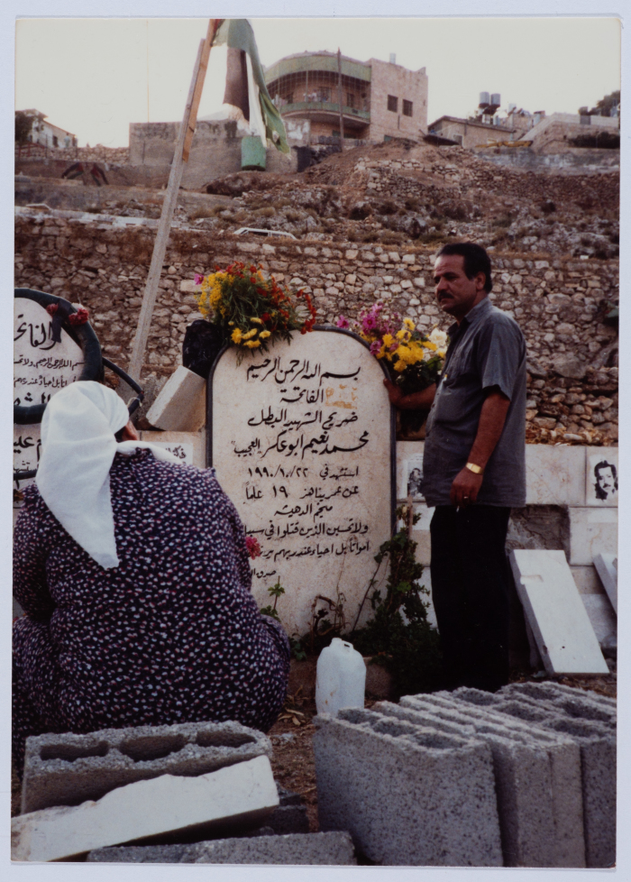 The Shaheed Mohammad Abu ʿaker's Parents at his Tombstone 