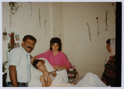 ʿatef and Khawla Abu ʿaker visit the Shaheed Mohammad Abu ʿaker at al-Makassed Hospital 