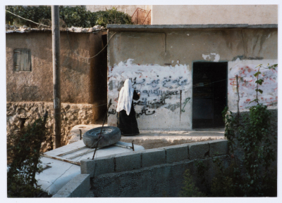 A Woman Writing on a Wall in Dheisheh Refugee Camp
