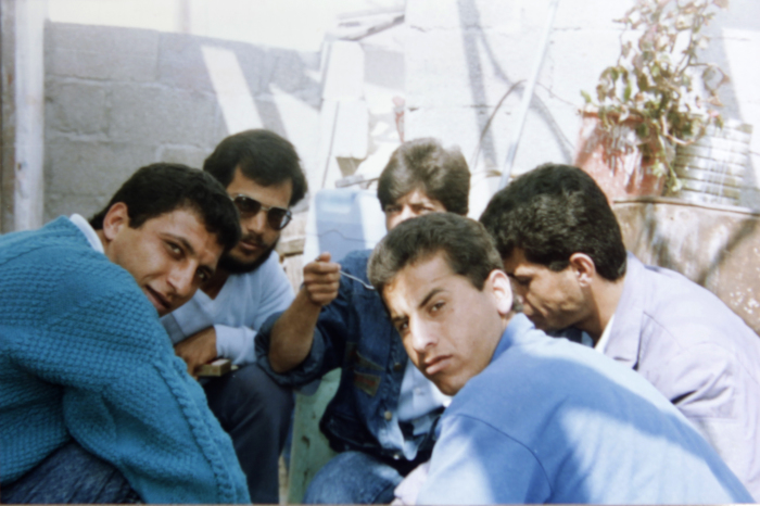 A Photograph of Nidal abu Aker and His Friends Having a Meal