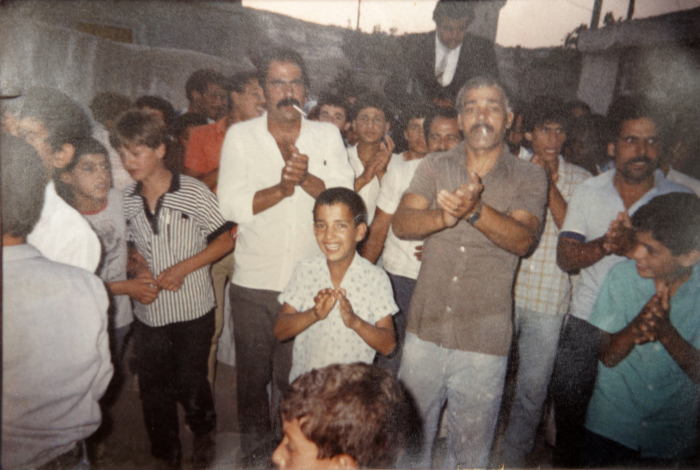 A Photograph of Tawfiq Id with Palestinian Refugees in Dheisheh Refugee Camp during a Wedding Ceremony 