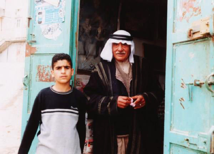 A Photograph of Ṣubhy Ubaidullah and a Young Man in  Dheisheh Palestinian Refugee Camp