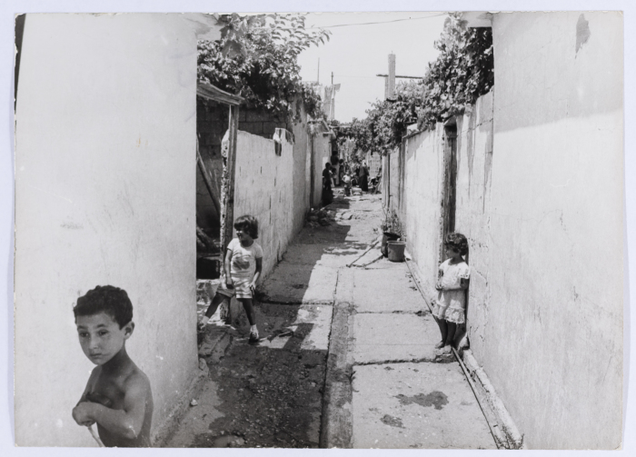 Kids Standing in one of the trenches of Shatila Refugee Camp 
