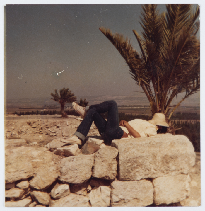 Artist ʿaṣim Abu Shaqra Laying on a Rock 