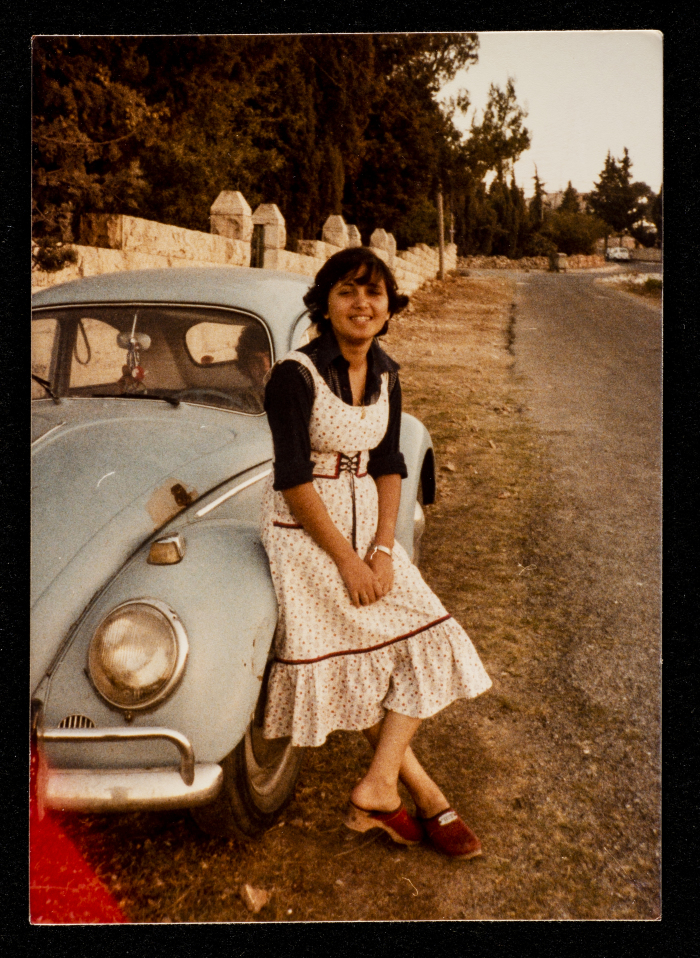 A Photograph of Zoya Batrawy Leaning on Abdul Latif Aqel's Car in al-Bireh, 1975
