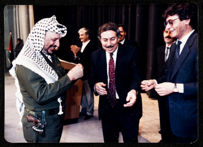Mahmud Darwish, ʿabdalla al-Hurany, and Yaser ʿarafat at the Presidential Headquarters in Ramallah, 1996  