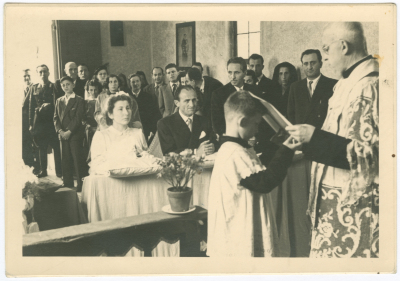 A Photograph of a Wedding at a Church 
