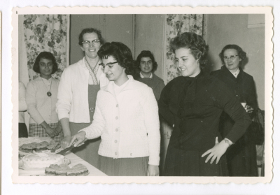 A girl cutting the cake