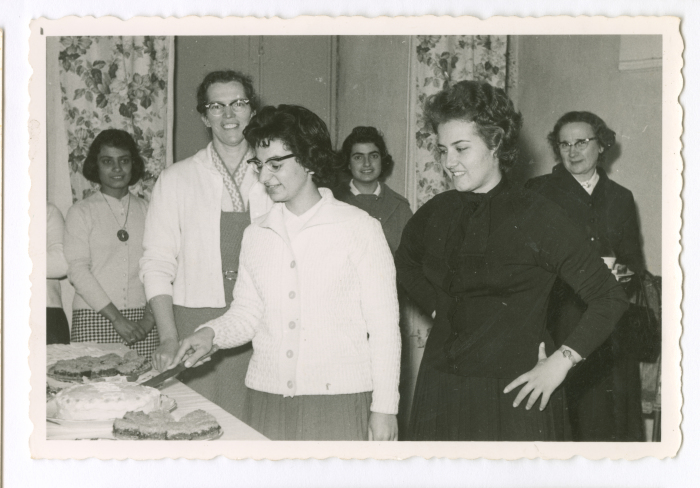 A girl cutting the cake