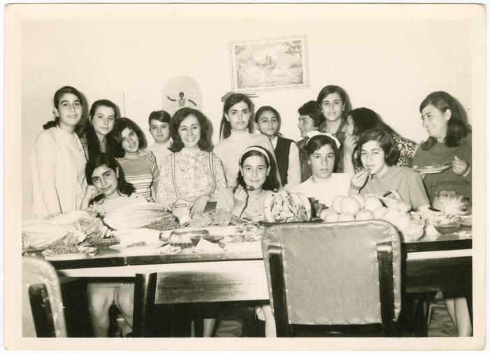 A family celebrating their daughter's birthday