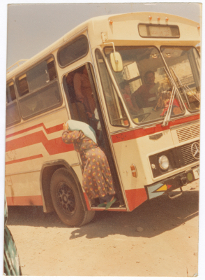 A women getting off the bus