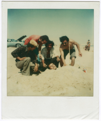 Friends playing with sand