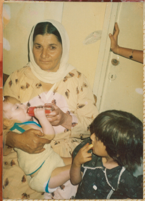 A woman from Shalaby Family holding Ameer Mohammad Shalaby