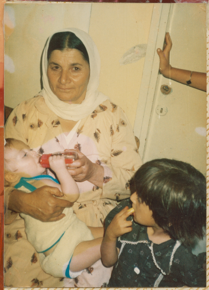 A woman from Shalaby Family holding Ameer Mohammad Shalaby