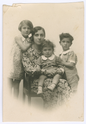 A mother from Mansour Family with her children