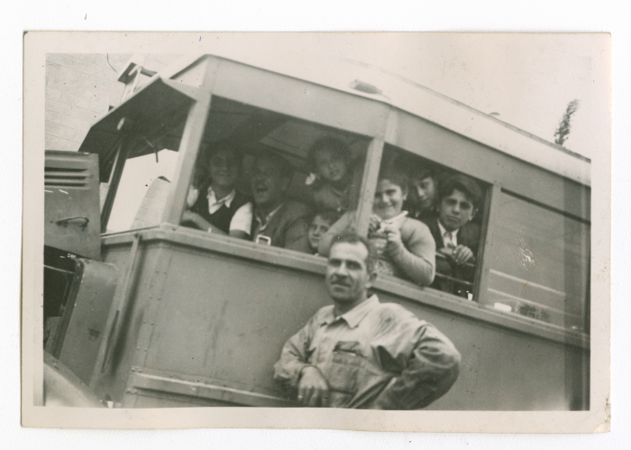 A family on an armoured bus