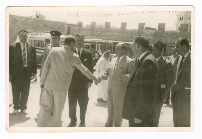 A photograph of men at a Palestinian Bus Company