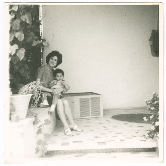 A woman from Abu Ghazaleh hugging her nephew