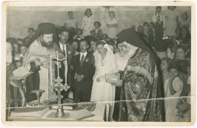 Newlyweds with clergymen at the wedding ceremony