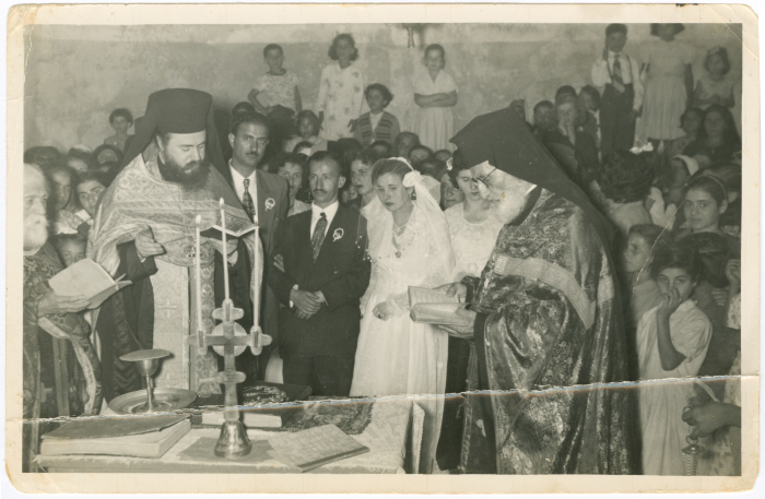 Newlyweds with clergymen at the wedding ceremony