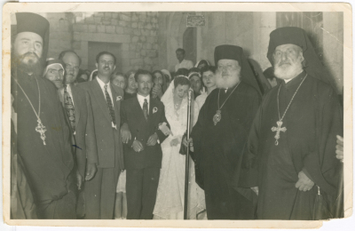 Newlyweds with clergymen at the wedding ceremony