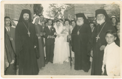 Newlyweds with clergymen at the wedding ceremony