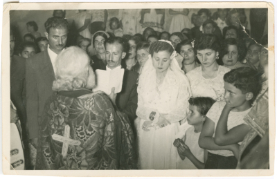 Newlyweds with a clergyman at their wedding