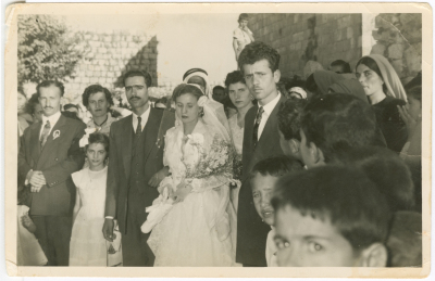 Newlyweds with their relatives at the wedding
