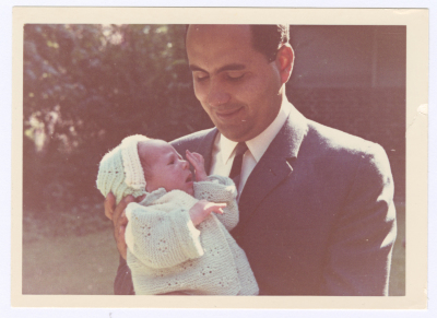 A Father Holding His Newborn. 