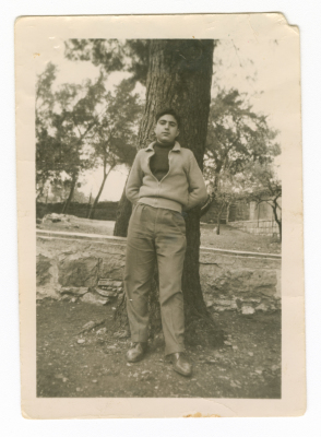 A man in front of a college