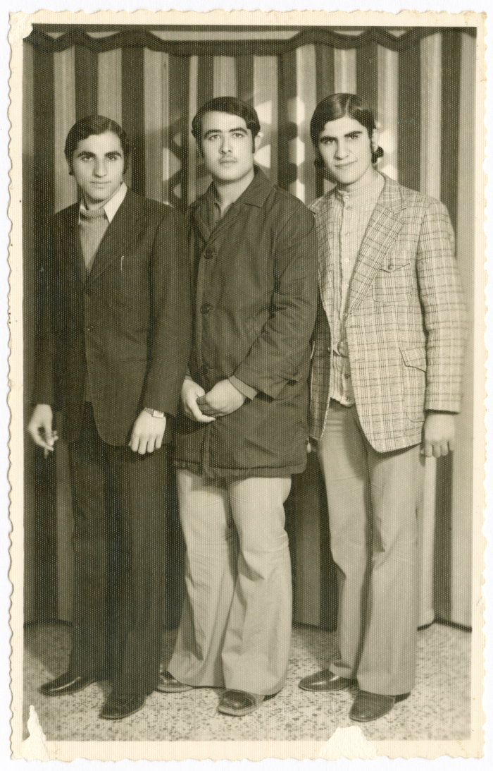 Mohammad Abu Farha with his children in a studio