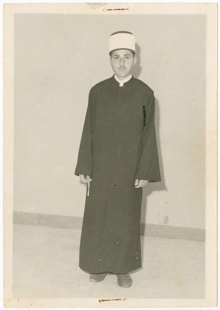 A young man wearing the Amama; Turban