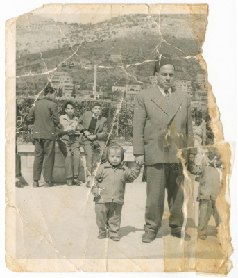A man and two children from Risha Family at the roundabout of Nablus City