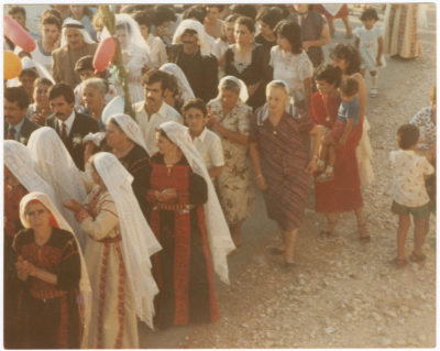 Men and women during a Zaffa; bringing the bride from her father