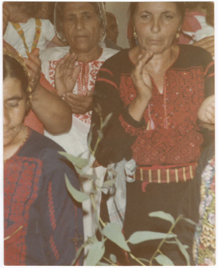 Women clapping at a wedding