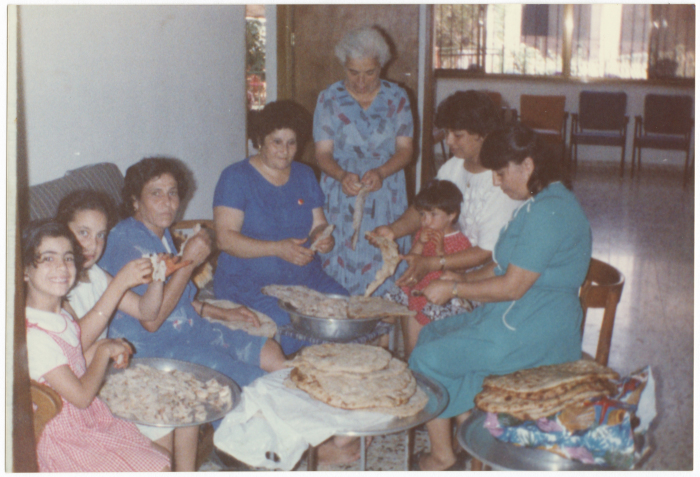 Women shredding bread; in preparation, for Mansaf