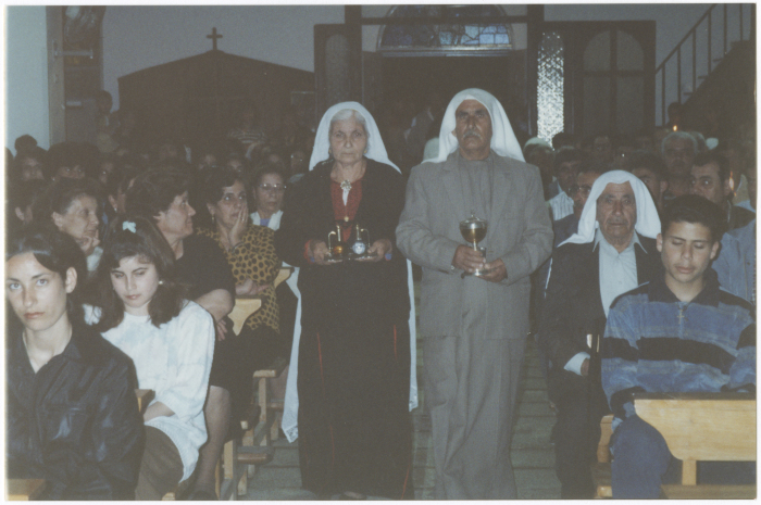 People from Áboúd in a church