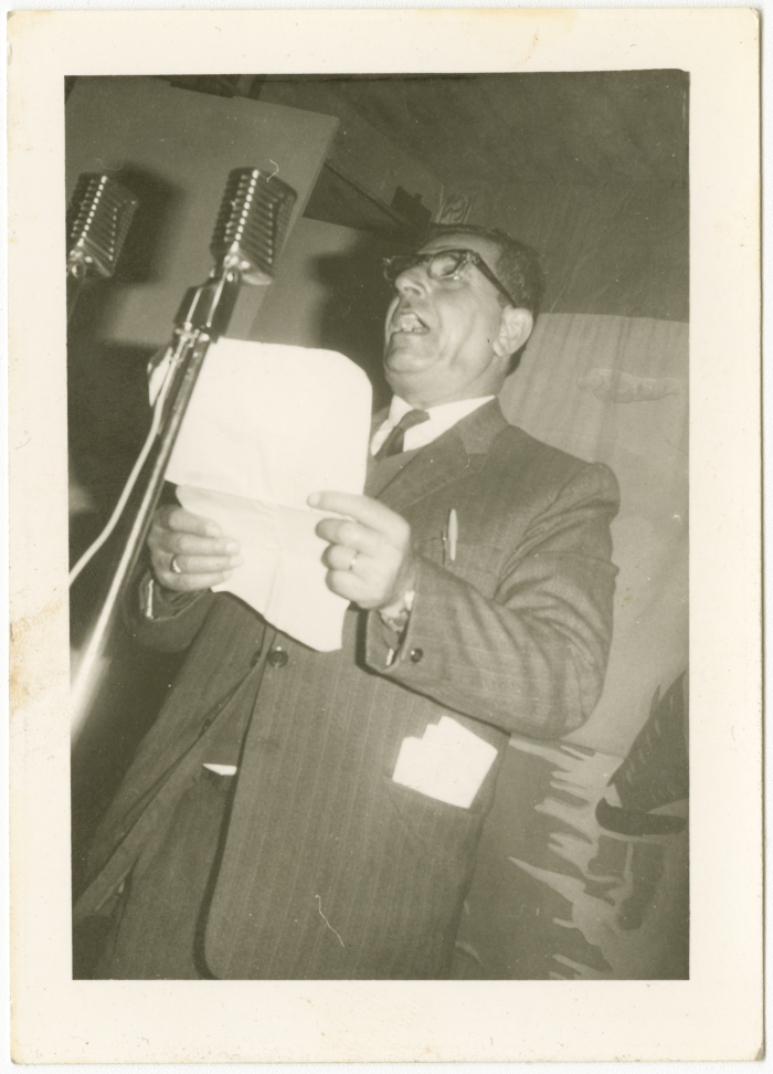 Poet Jabir Dababneh reciting a poem at a memorial service