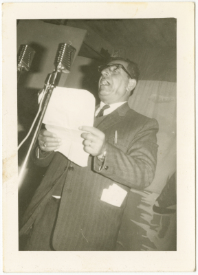 Poet Jabir Dababneh reciting a poem at a memorial service