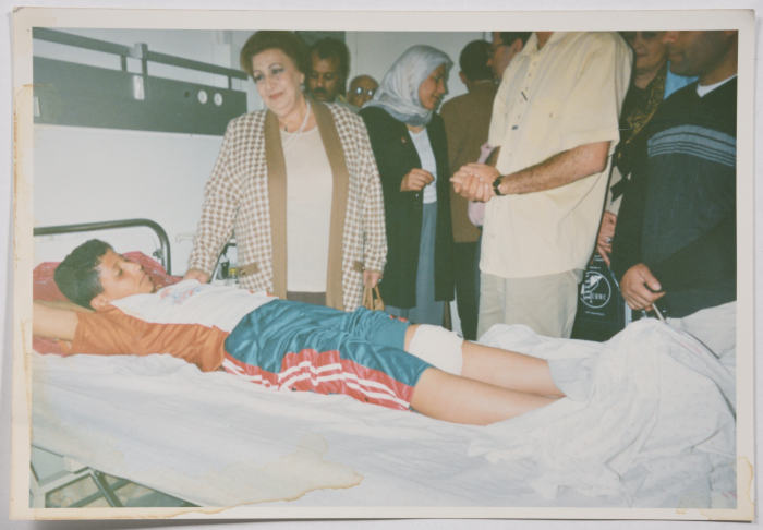 The fighter Najla Yassin checking on the injured.